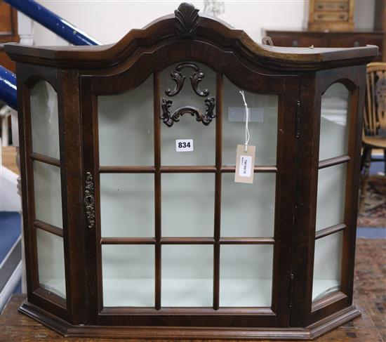 A Dutch style walnut table top glazed display cabinet with canted sides, W 29in